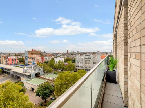 an apartment balcony with a view of a city at Numa Berlin Drift in Berlin