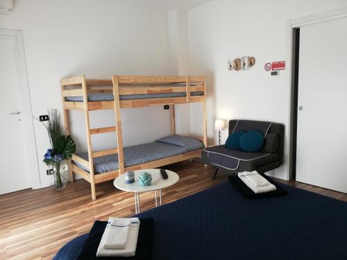 a living room with a bunk bed and a couch at Cristel Malpensa apartment in Cardano al Campo