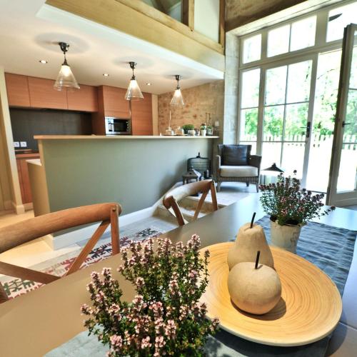 a living room with a table with two pears on it at Manoir de Malagorse in Cuzance