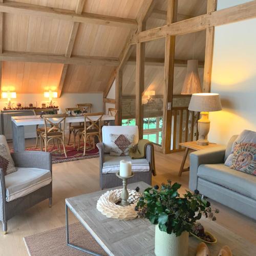 a living room with chairs and a table at Manoir de Malagorse in Cuzance