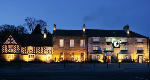 a large building is lit up at night at The Black Swan - The Inn Collection Group in Helmsley