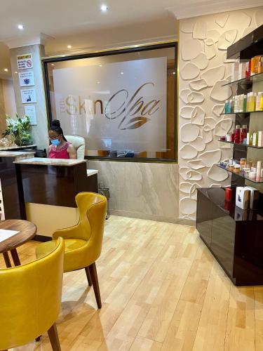 a woman sitting at a counter in a salon at Masawara Urban Retreat in Harare