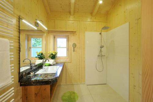 a bathroom with a sink and a shower at Lamplhof in Rimsting