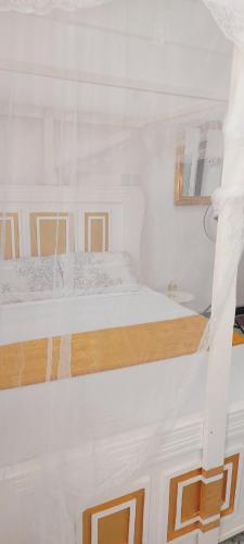 Postel nebo postele na pokoji v ubytování Neighbourly Nest