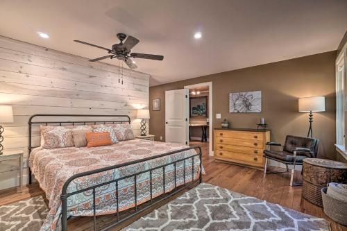 a bedroom with a bed and a ceiling fan at Riverfront Tallulah Falls Cabin with Hot Tub! in Tallulah Falls