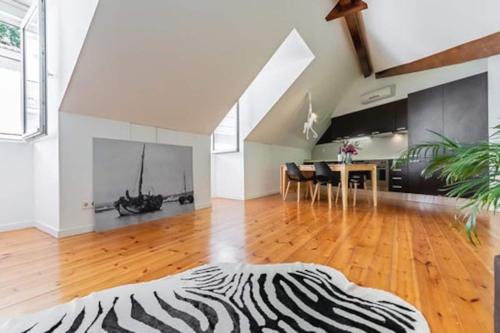 a living room with a zebra rug on a wooden floor at Downtown - Chiado & Me 2 in Lisbon