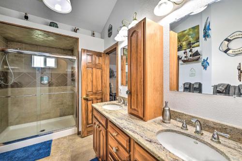 a bathroom with a sink and a shower at The Vineyard Country Farm Home at Grand Valley in Grand Junction
