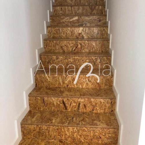 a marble staircase with a sign that reads amazon at AmaRiaCity AL in Aveiro