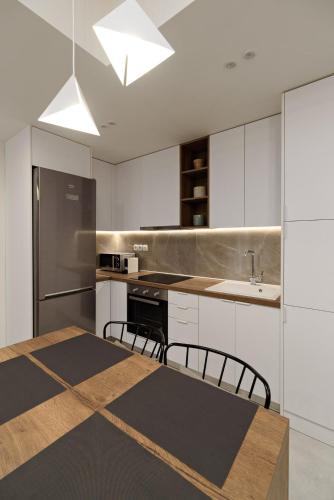 Kuchyň nebo kuchyňský kout v ubytování Blu & Marrone Suites-parking included