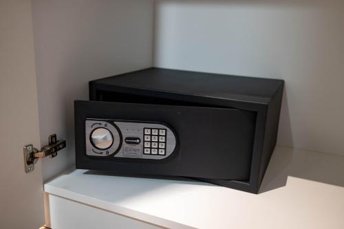 a microwave oven sitting on top of a counter at Omega Apartments in Vrnjačka Banja