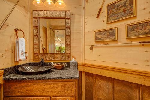a bathroom with a sink and a mirror at Talking Creek Lodge in Talking Rock