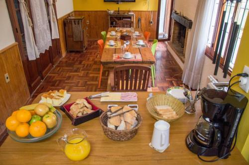 a table with plates of food on top of it at Cane B&B in Montevideo