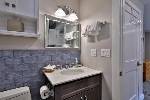 a bathroom with a sink and a mirror at Kettle Brook A in Ludlow