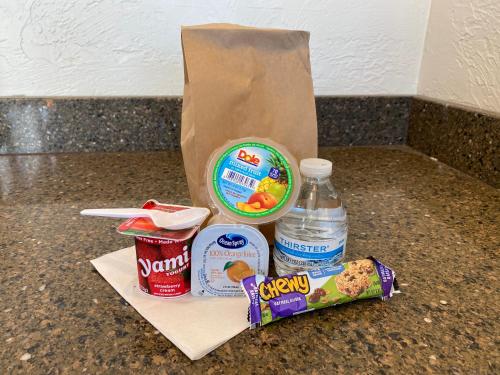 a bag of food and a bottle of water on a counter at BeachCombers Inn in Gold Beach