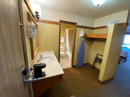 a bathroom with a sink and a toilet at BeachCombers Inn in Gold Beach