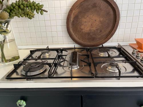 a pot sitting on top of a stove top at TREETOPS PENTHOUSE Rose Bay Sydney, 3 bedrooms in Sydney