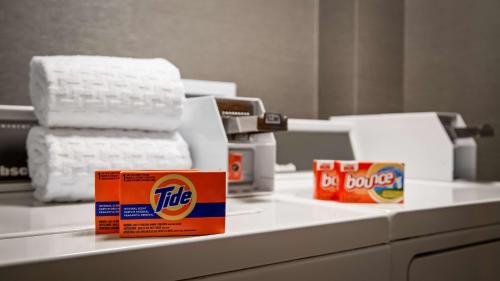 a pile of rolls of toilet paper on a counter at Best Western Plus North Canton Inn & Suites in North Canton