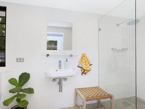 a bathroom with a sink and a glass shower at Lovett in Mittagong