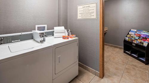 a washroom with a sink and a counter with aounter at Best Western Plus North Canton Inn & Suites in North Canton
