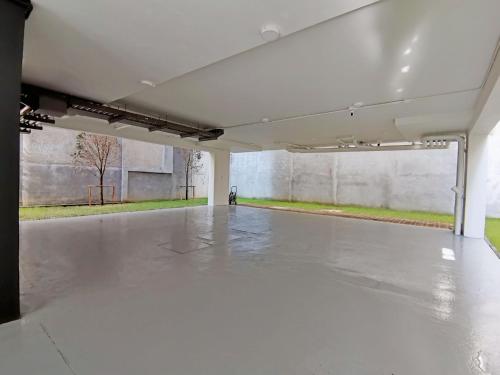 a large empty room with a concrete floor at The Lantern Hatyai Hotel in Hat Yai