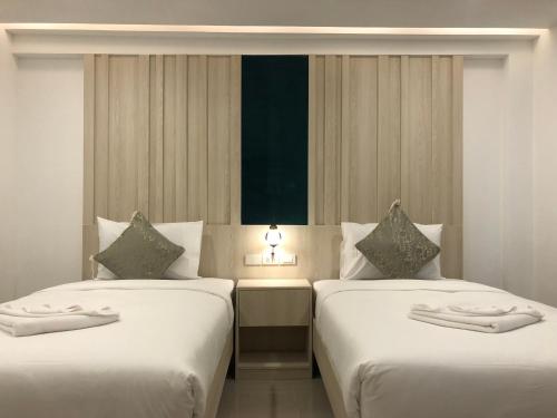 Vista Hotel Chiang Mai - SHA EXTRA PLUS房間的床
