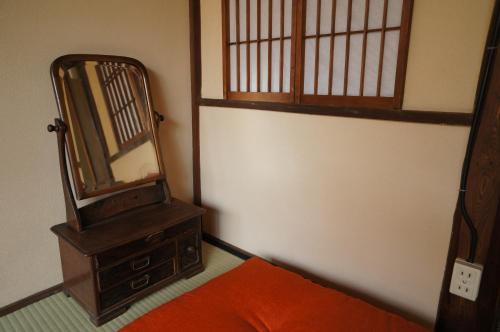 Una cama o camas en una habitación de Guesthouse Itoya Kyoto