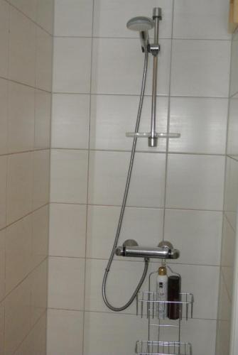 a shower with a shower head in a bathroom at Trysil Alpin 16A Top location in Trysil