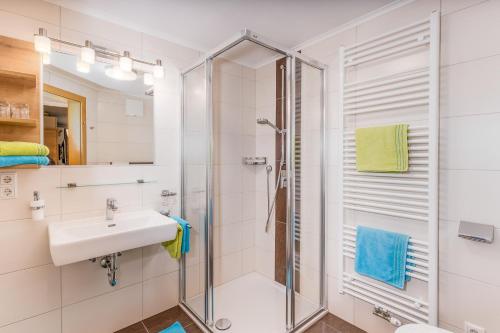 a bathroom with a shower and a sink at Tobhartbauer in Dorfgastein