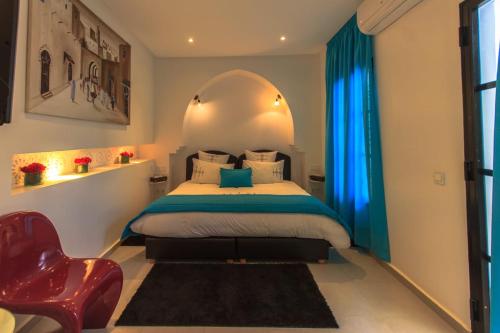 A bed or beds in a room at Riad Dar Augusta