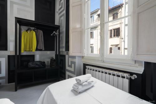 a room with a white table and a window at Hotel Spagna in Florence