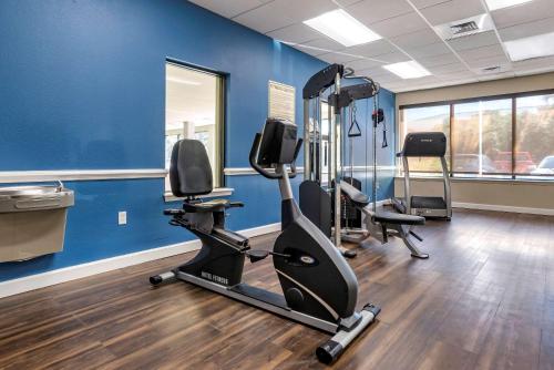 a gym with tread machines in a room with blue walls at Comfort Inn & Suites Fort Walton Beach - Destin West in Fort Walton Beach