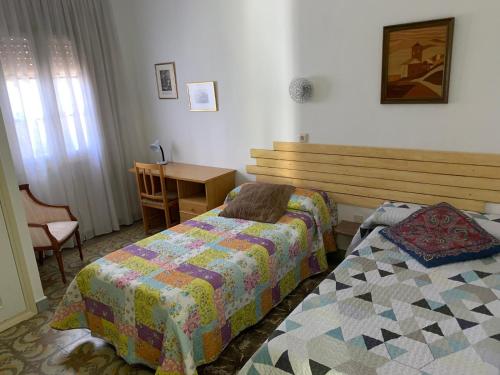 Katil atau katil-katil dalam bilik di Ermita del Carmen Híjar
