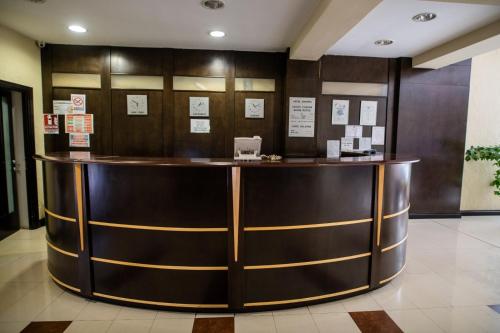 a lobby with a counter in a building at Hotel Vaslui in Vaslui
