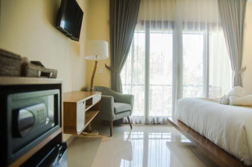 Postel nebo postele na pokoji v ubytování Akatara Hotel