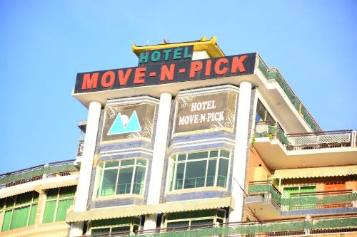 a building with a hotel move n pick sign on it at Move-N-Pick Murree in Murree