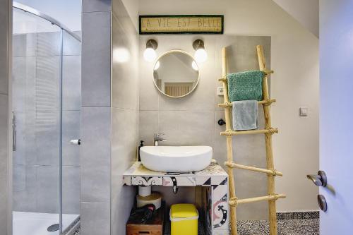 a bathroom with a sink and a mirror at BY's home in Zagreb