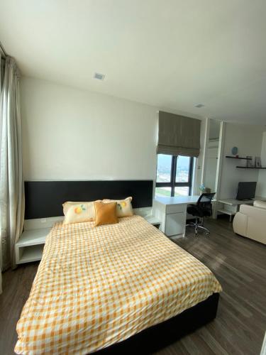 a bedroom with a bed with a checkered blanket at Corner Unit Landmark Residence 2, High Floor, Nice View, WiFi & Tvbox, Free Parking in Kajang