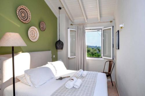 Posteľ alebo postele v izbe v ubytovaní Hammock House
