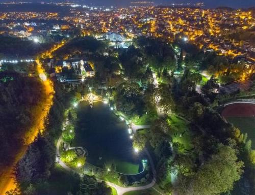 an aerial view of a park at night with lights at Guest House Sofia in Sandanski
