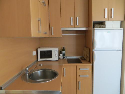 Kuchyňa alebo kuchynka v ubytovaní ATICO PUNTA UMBRIA 4 PERSONAS y Parking