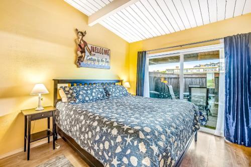 a bedroom with a bed and a window at Cottage by the Sea in Gearhart