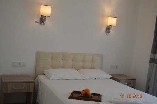 Ένα ή περισσότερα κρεβάτια σε δωμάτιο στο Hotel Uygar