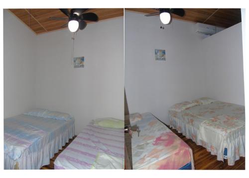 a room with two beds and a ceiling fan at Hostal Villas Mexico in San Juan del Sur