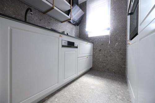 Kuchyň nebo kuchyňský kout v ubytování Premium Apartmani Banja Luka