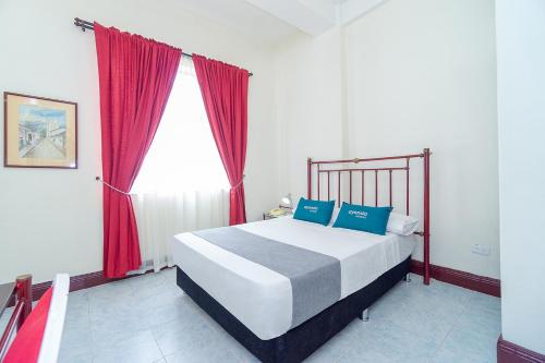 Cama o camas de una habitación en Hotel Astoria Real