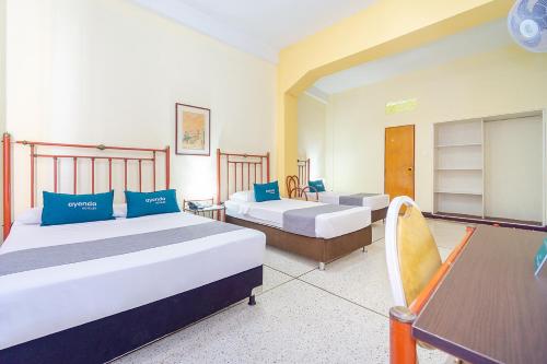 Cama ou camas em um quarto em Hotel Astoria Real