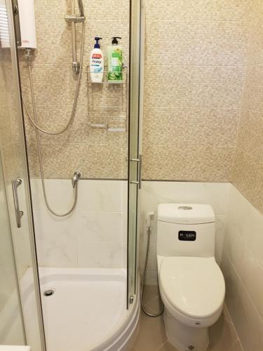 a bathroom with a shower with a toilet and a shower at Project 17 in Hua Hin