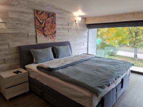 Ένα ή περισσότερα κρεβάτια σε δωμάτιο στο GRANDE SPA DELUXe STUDIOS