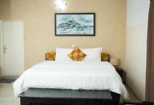 Voodi või voodid majutusasutuse Hôtel Seaside toas