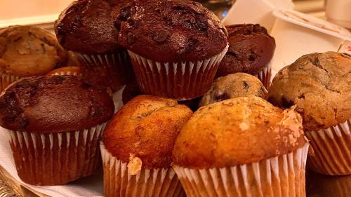 a pile of muffins and muffins in a box at Bli Bli House Riverside Retreat in Twin Waters